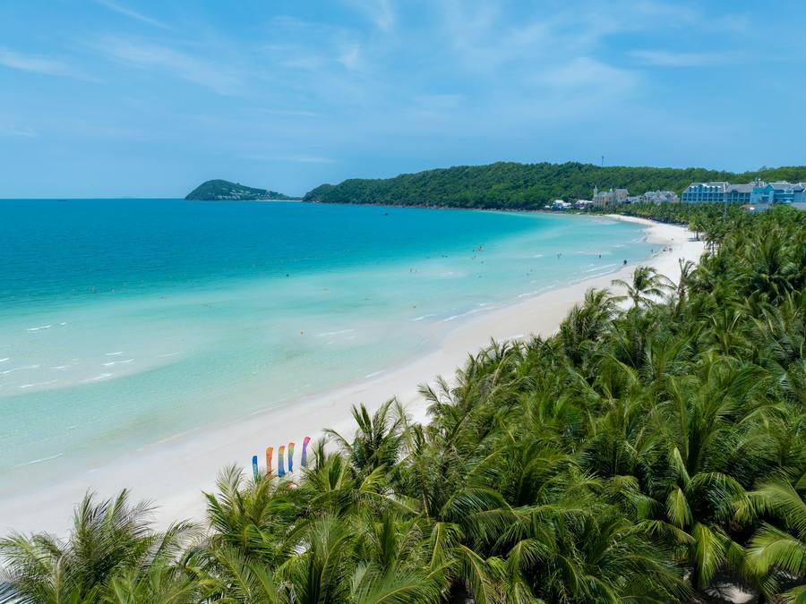 Turquoise water and palm-lined beach on Phu Quoc island